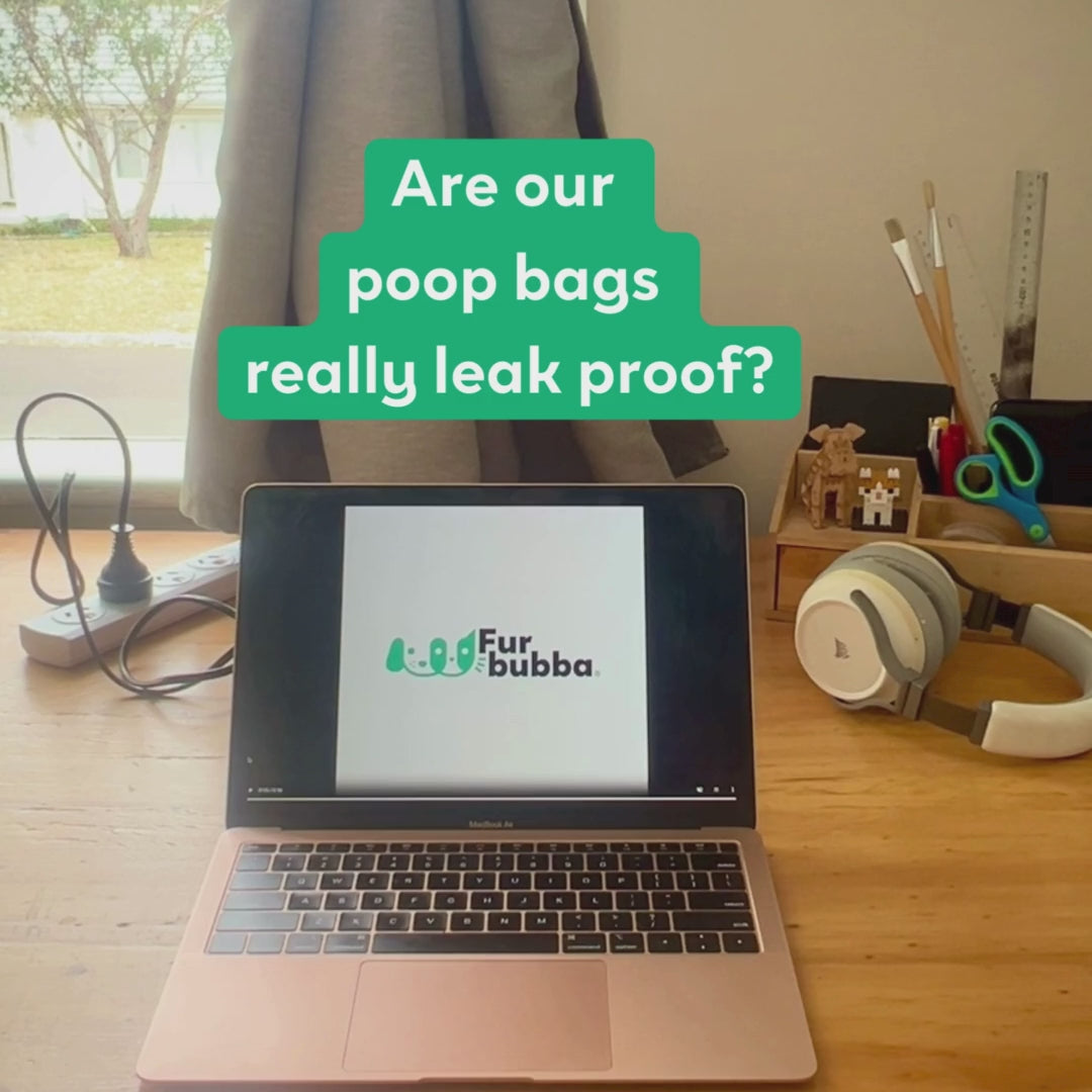 Strong water proof biodegradeable dog poop bags. Water pouring into Furbubba compostable dog bags over a computer.