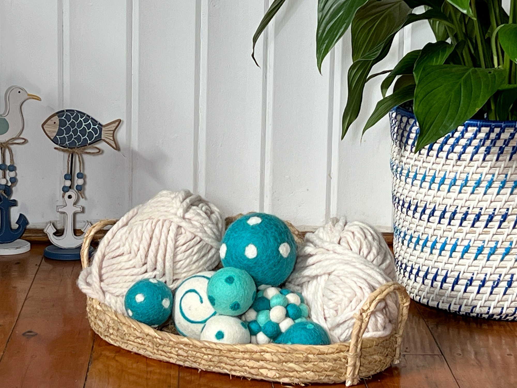 Collection of blue and white wool cat toy balls