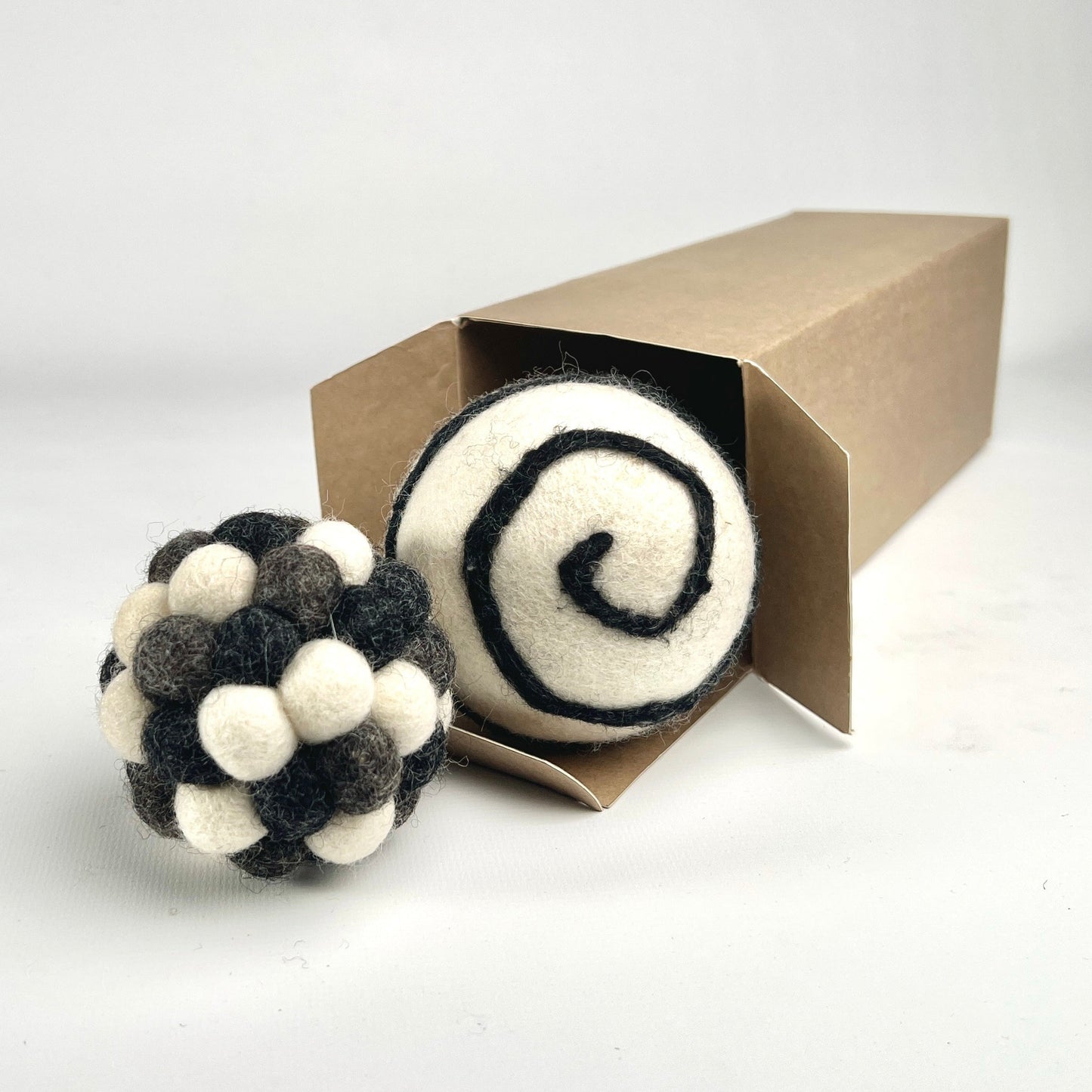 Cat Toys - two large felt balls in a box, grey multi-colour and white with black swirl