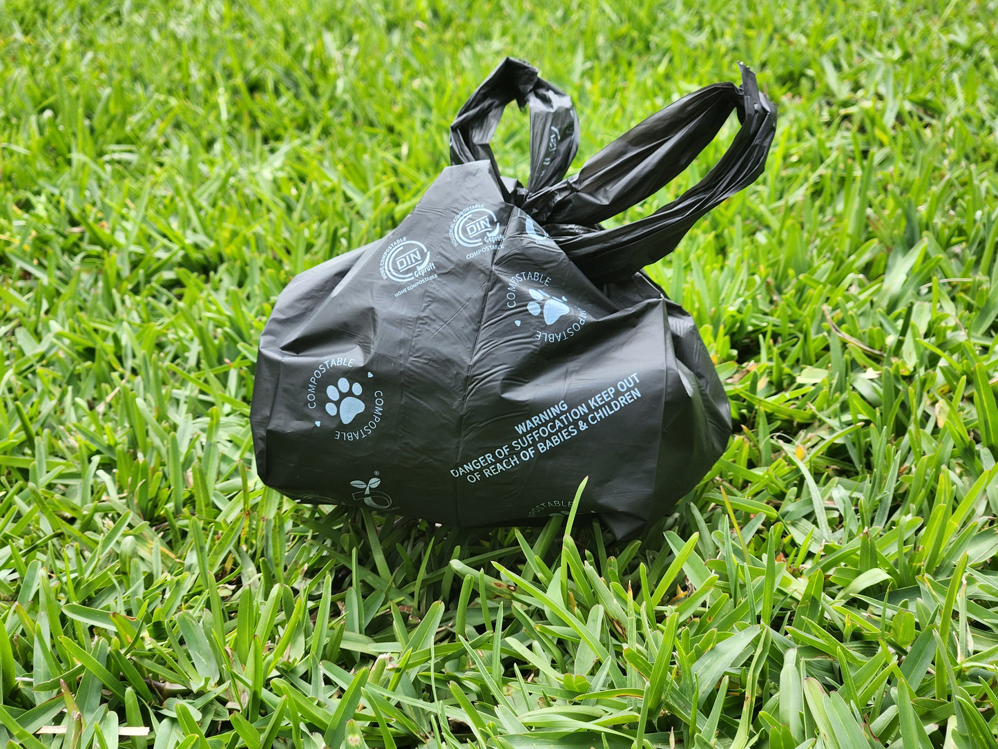 Furbubba Doggie Poop Bags on Grass, Compostable Cornstarch Dog Waste Bags. Biodegradable Dog Poo Brags